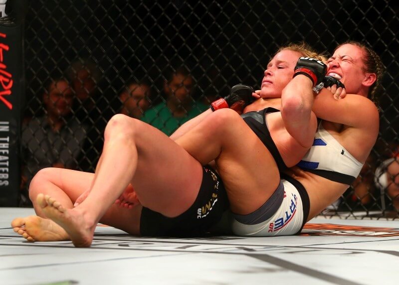 March 5, 2016; Las Vegas, NV, USA; Miesha Tate applies a chokehold to win by submission against Holly Holm during UFC 196 at MGM Grand Garden Arena. Mandatory Credit: Mark J. Rebilas-USA TODAY Sports