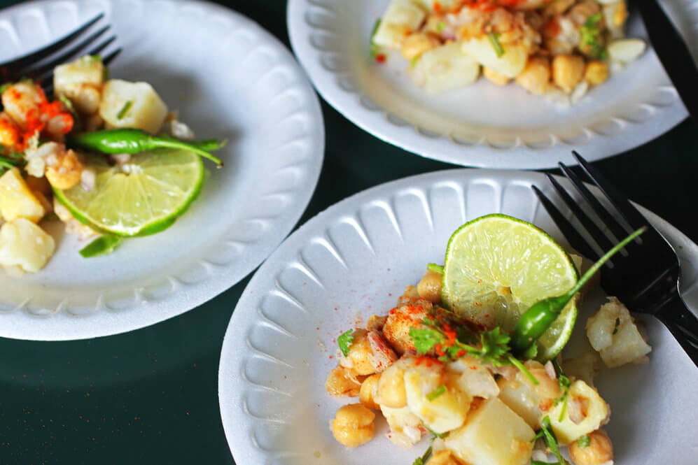 Bengalis celebrate their new year with fanfare and gastronomical indulgence. Begin with Alu Kabli, or Tangy Potato and Chickpea Salad. This is a popular street food as well as a homey snack, especially after school for young children. Recipe from “The Bengali Five Spice Chronicles” cookbook. Credit: Copyright 2016 Rinku Bhattacharya