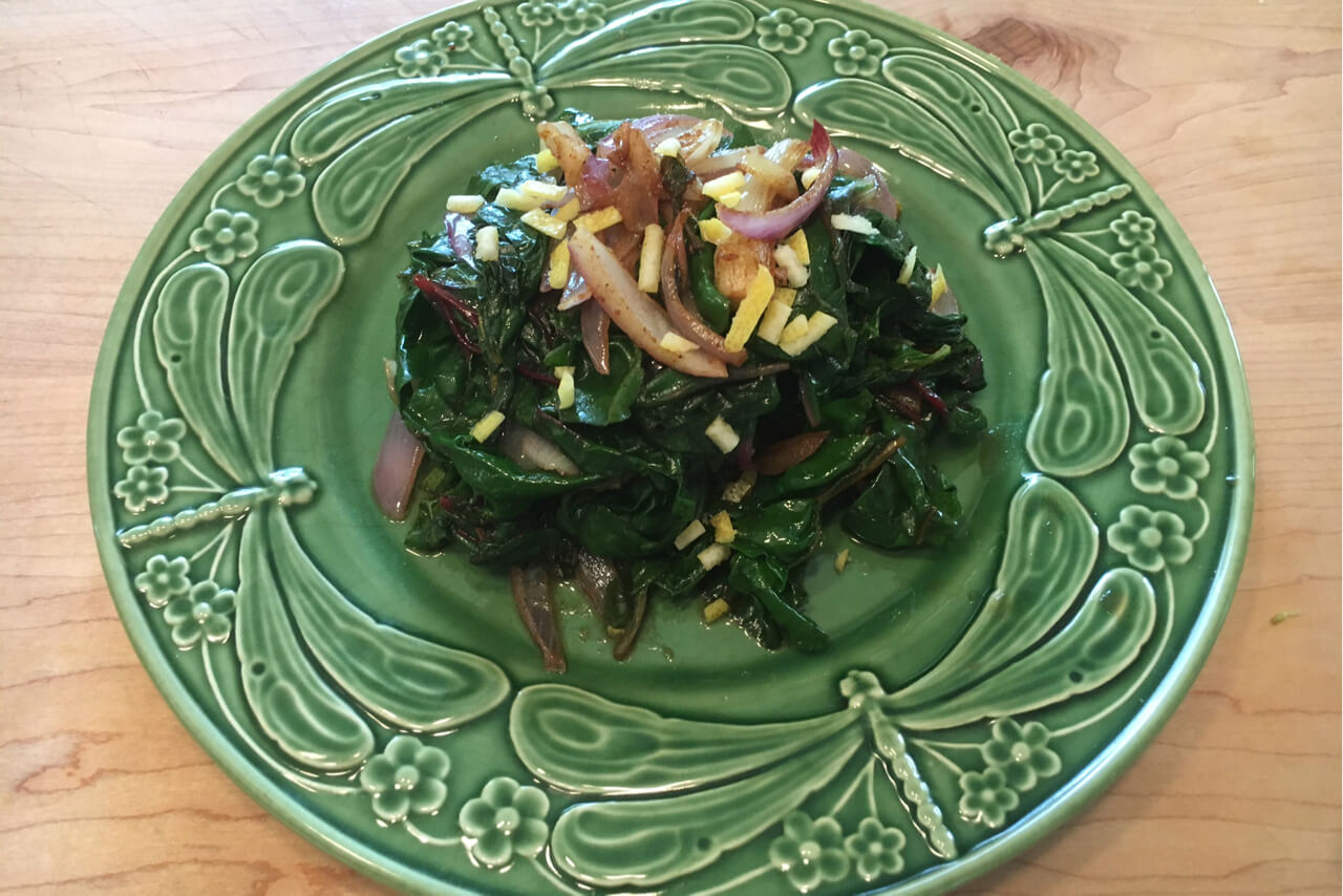 Moroccan greens are made with caramelized red onions, A Moroccan spice blend and preserved lemons. Credit: Copyright 2016 Marie Simmons