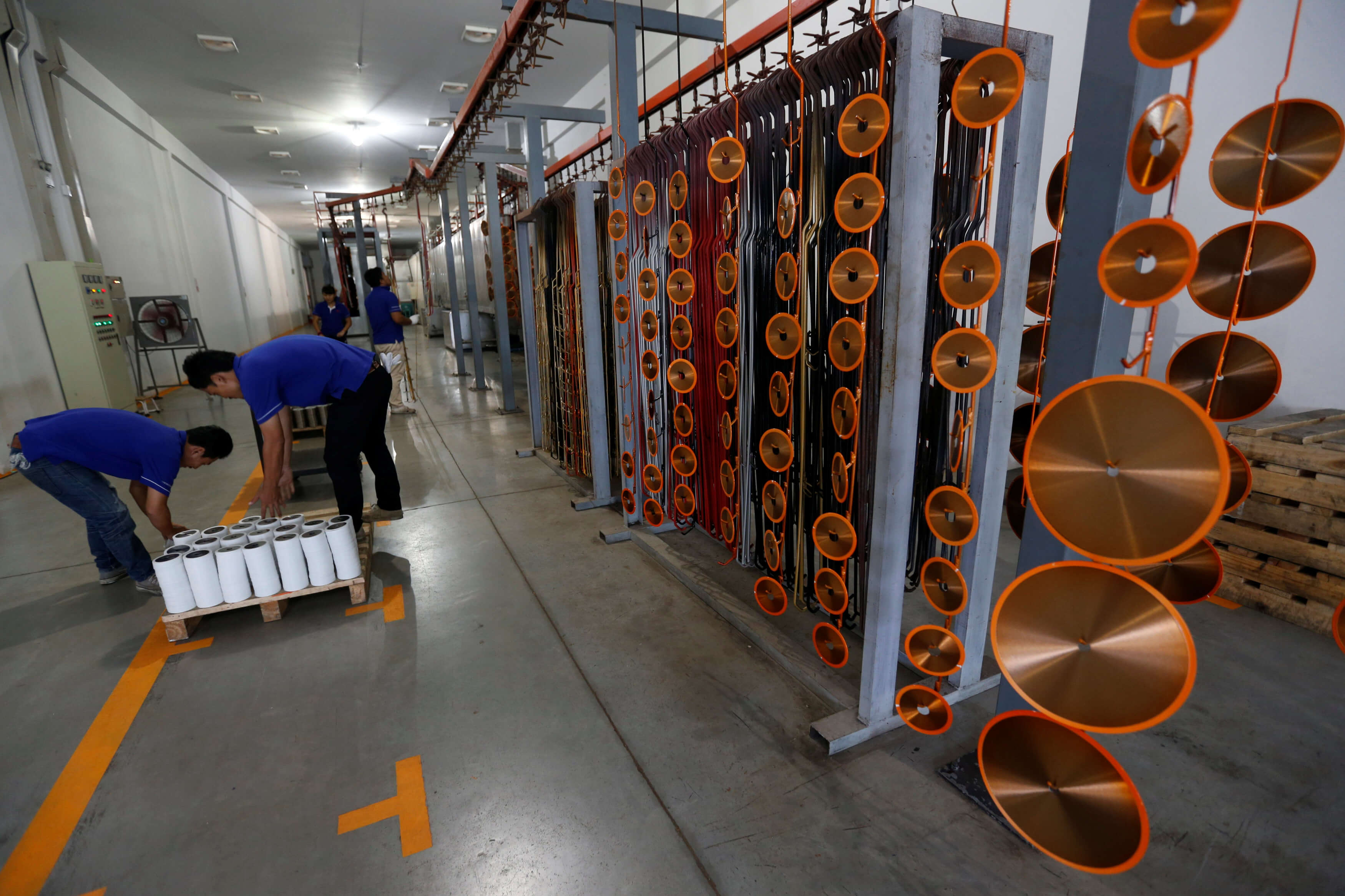 Employees arrange blades for construction at an assembly line at Gang Yan Diamond Tools, a Chinese manufacturing plant, located in the Thai-Chinese Rayong Industrial Zone in Rayong province, east of Bangkok, Thailand, April 7, 2016. REUTERS/Chaiwat Subprasom