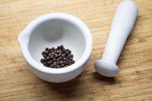 Black peppercorns with pestle and mortar. Credit: iStock Christopher Stokey