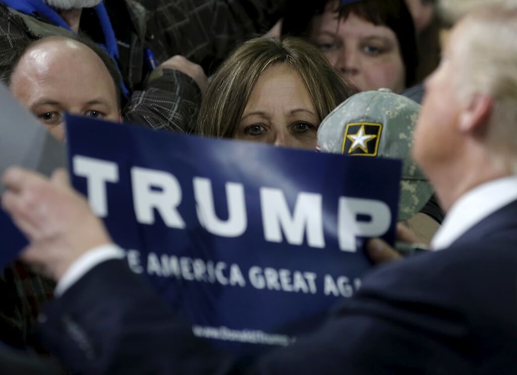 Supporters wait to get an autograph from U.S. Republican presidential candidate Donald Trump at a campaign rally in Cadillac, Michigan, March 4, 2016. REUTERS/Jim Young
