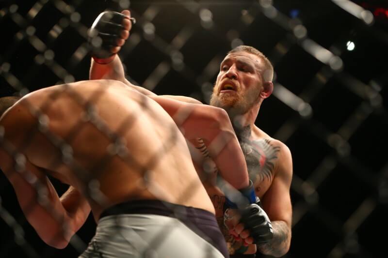 March 5, 2016; Las Vegas, NV, USA; Conor McGregor moves in for a punch against Nate Diaz during UFC 196 at MGM Grand Garden Arena. Mandatory Credit: Mark J. Rebilas-USA TODAY Sports