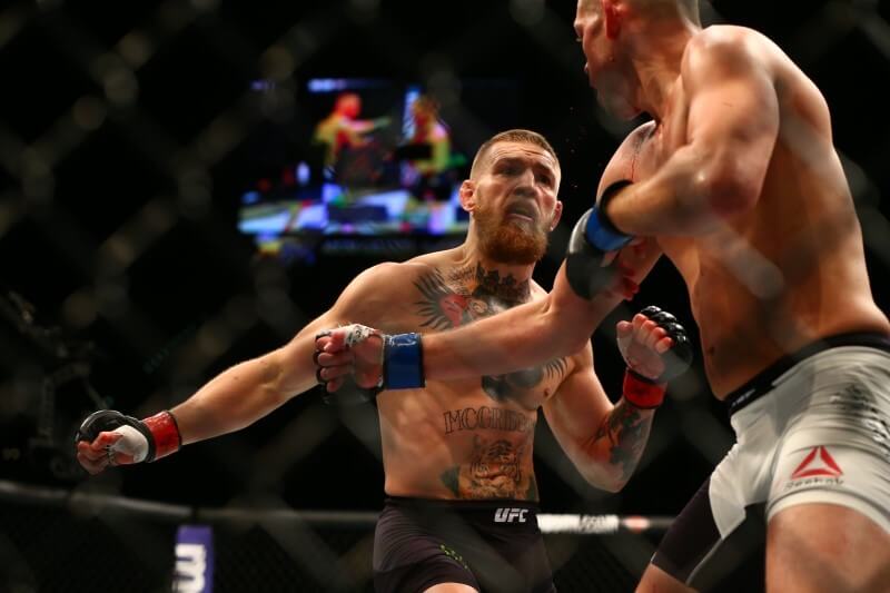 March 5, 2016; Las Vegas, NV, USA; Conor McGregor moves in for a punch against Nate Diaz during UFC 196 at MGM Grand Garden Arena. Mandatory Credit: Mark J. Rebilas-USA TODAY Sports