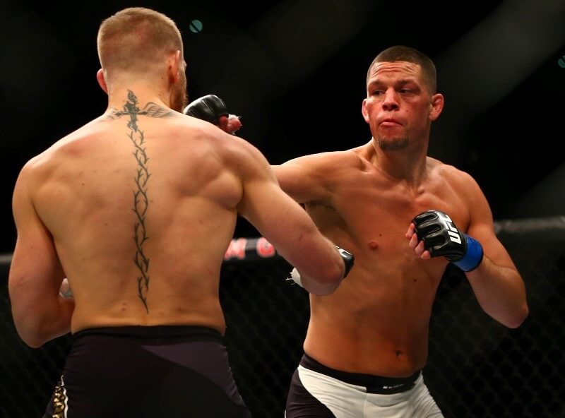 March 5, 2016; Las Vegas, NV, USA; Nate Diaz lands a punch against Conor McGregor during UFC 196 at MGM Grand Garden Arena. Mandatory Credit: Mark J. Rebilas-USA TODAY Sports