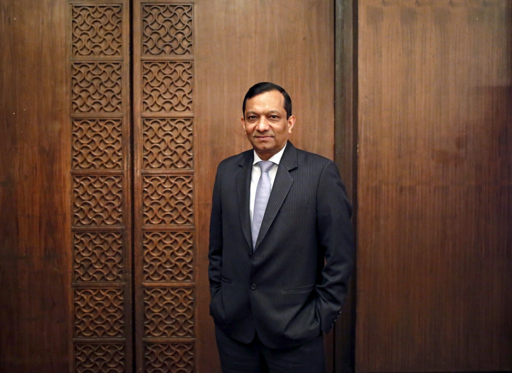 Pawan Goenka, president of Mahindra's automotive and farm equipment sectors, poses after his interview with Reuters in New Delhi in this September 11, 2014 file photo.  REUTERS/Anindito Mukherjee/Files