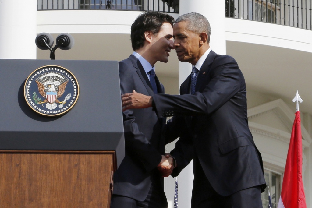 U.S. President Barack Obama (R) shakes hands with Canadian Prime Minister Justin Trudeau (L) during the arrival ceremony at the White House in Washington March 10, 2016. REUTERS/Jonathan Ernst
