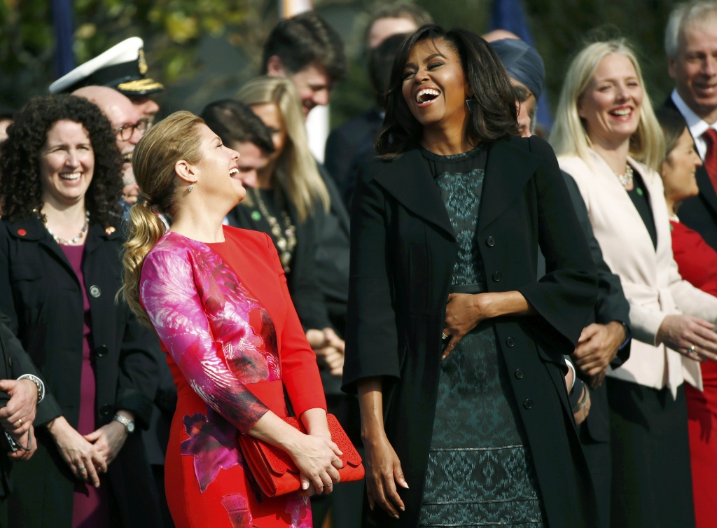 U.S. First lady Michelle Obama (R) and Sophie Gregoire Trudeau (L) laugh at the official arrival ceremony at the White House in Washington March 10, 2016. REUTERS/Kevin Lamarque