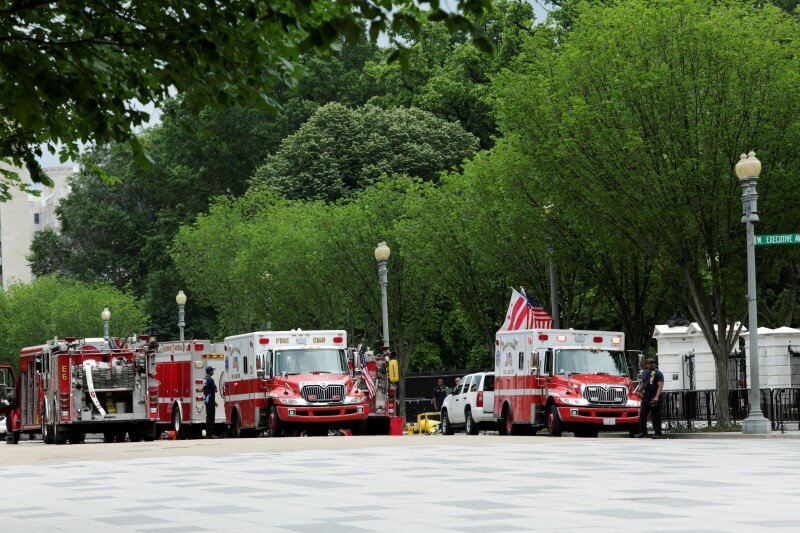 Firetrucks and ambulances are seen on Pennsylvania Avenue in front of the White House in Washington during a security lock down, U.S., May 30, 2016. REUTERS/Yuri Gripas