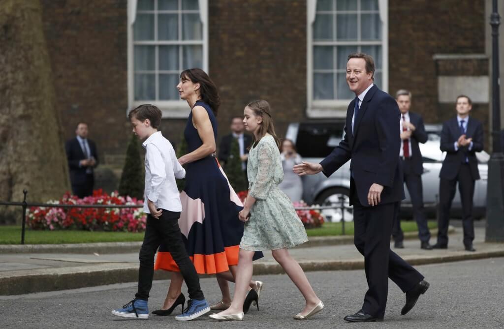 Britain's outgoing Prime Minister, David Cameron, accompanied by his wife Samantha, daughters Nancy and Florence and son Arthur, prepare to pose for photographs in front of number 10 Downing Street, on his last day in office as Prime Minister, in central London, Britain July 13, 2016. REUTERS/Stefan Wermuth